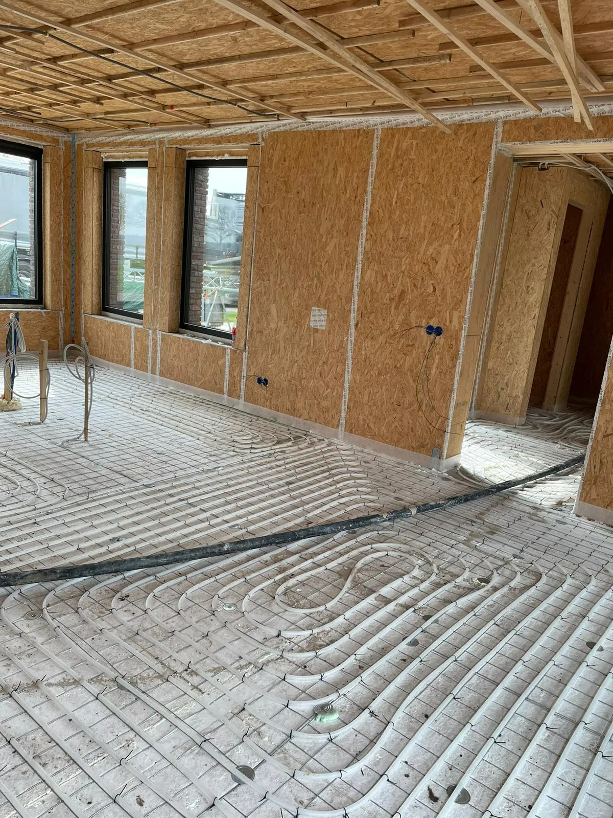 Beton ciré met vloerverwarming - HG Vloersystemen